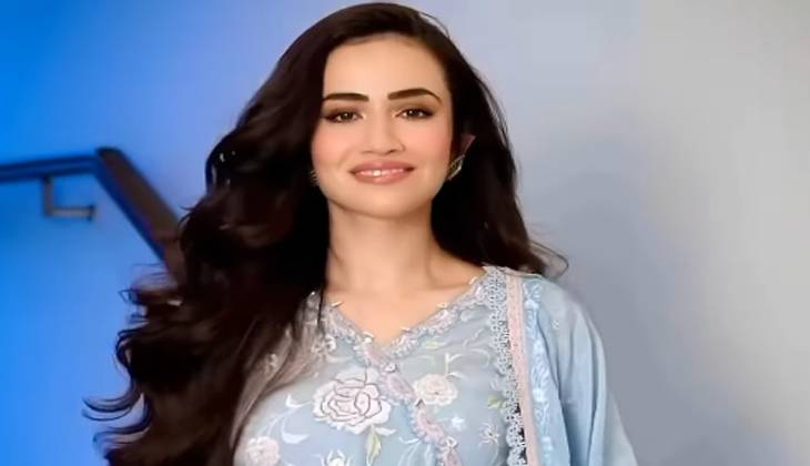 Sana Javed owns the frame in blue apparel.