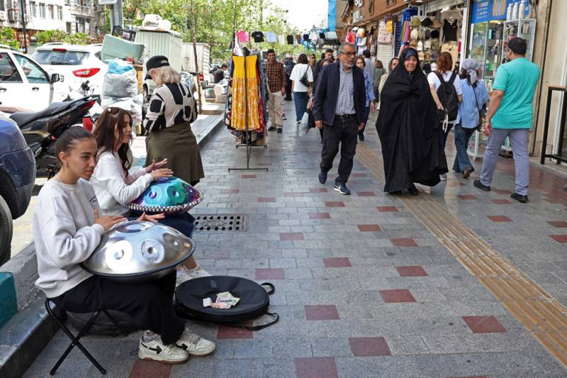 As some hijabs come off in Iran, restrictions still in place