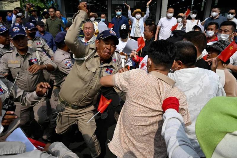 Two charged for Cambodia protests over frozen accounts with scam-linked firm