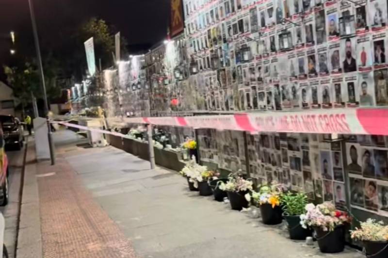 Two held after arson attack on London memorial for Iranian protesters