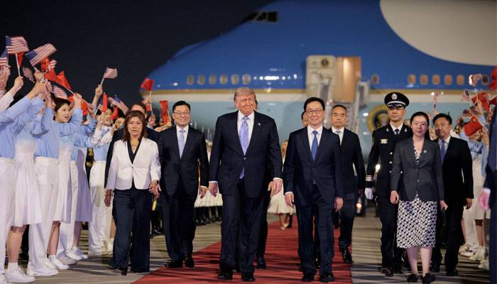 Trump arrives in China for superpower summit with Xi