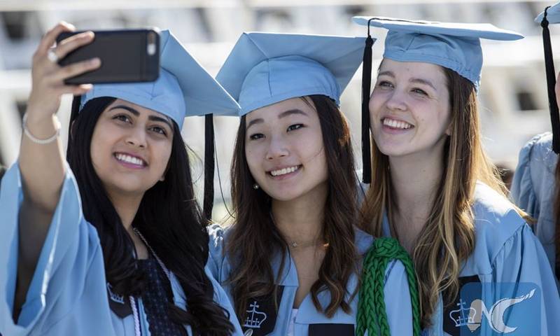 Bucking base, Trump defends Chinese students in US