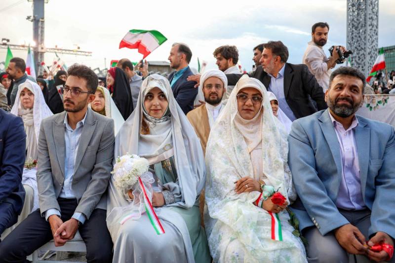 Iran stages mass weddings for couples ready for war 'sacrifice'