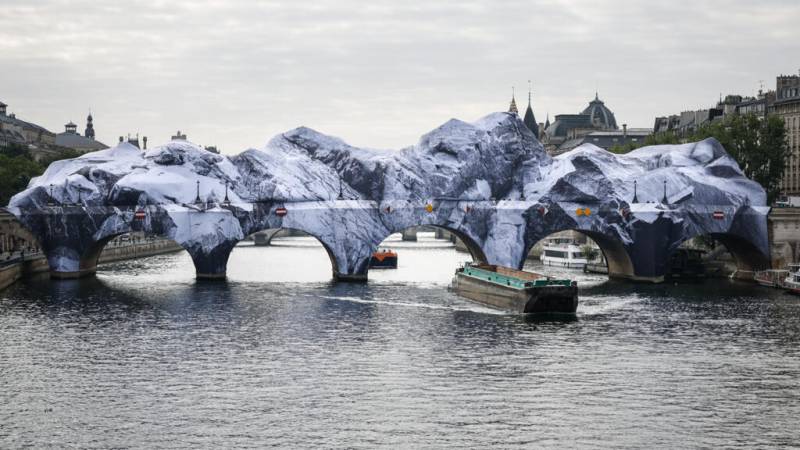 'French Banksy' and Daft Punk star turn Paris bridge into Alpine cave