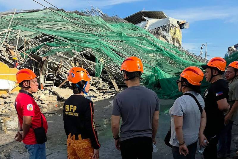 Rescuers search for 23 missing at collapsed Philippine building