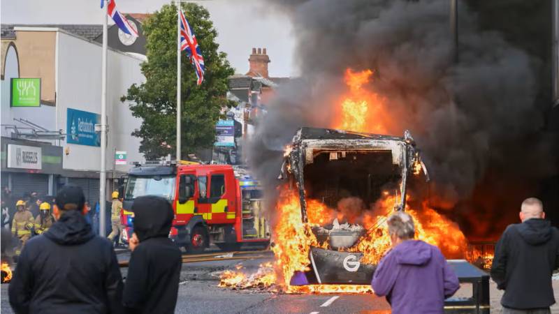 Protesters torch buildings and vehicles, block roads over Belfast stabbing