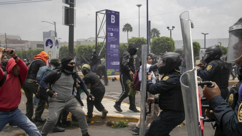 Police, protesters clash outside maiden World Cup match in Mexico