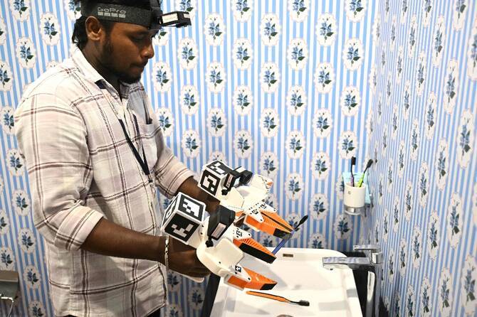 The Indian workers training AI robots to take their jobs