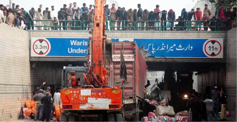 Truck gets stuck at Lahore’s Campus Underpass