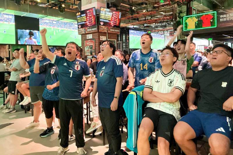 Fans in China put politics aside to cheer Japan at World Cup