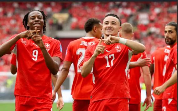 Switzerland down Canada to top Group B, both progress