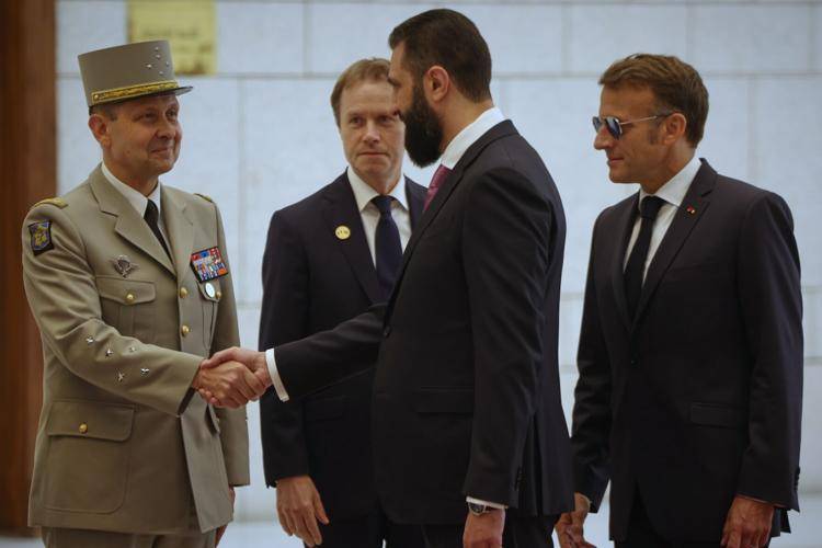 Syria says 18 wounded in Damascus blasts during Macron visit