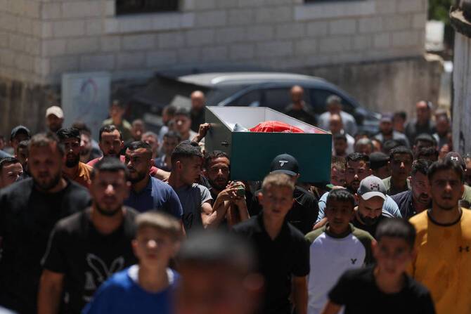 Palestinians say Israeli forces kill two during settler attack