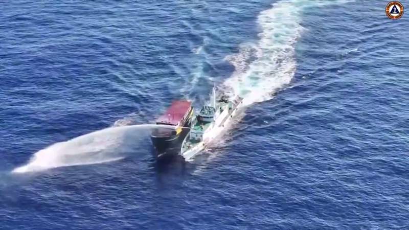 Philippines says ship hit by Chinese water cannon at disputed reef