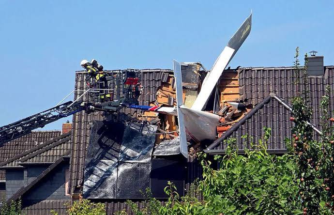 Two dead after plane crashes onto German house's roof