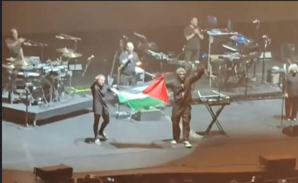 Singapore police probe Palestinian flag at Massive Attack concert