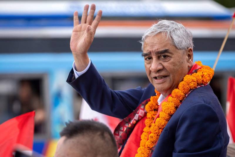 Former Nepal premier Deuba returns home, faces graft probe