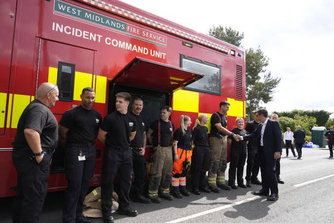 In wildfire town, PM says UK must 'face up to climate change'