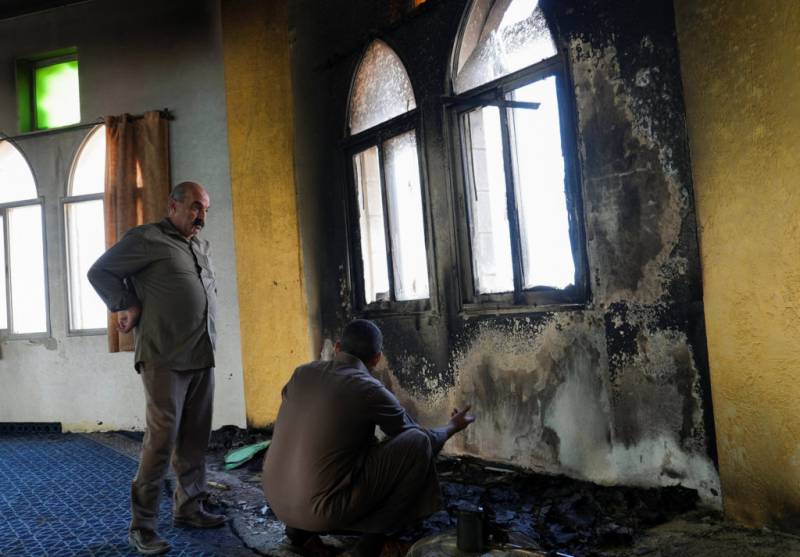 Israeli settlers torch West Bank mosque, Palestinians say