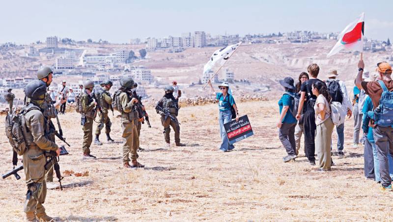 Driven by faith, activists stand up to fellow Jews to protect Palestinians