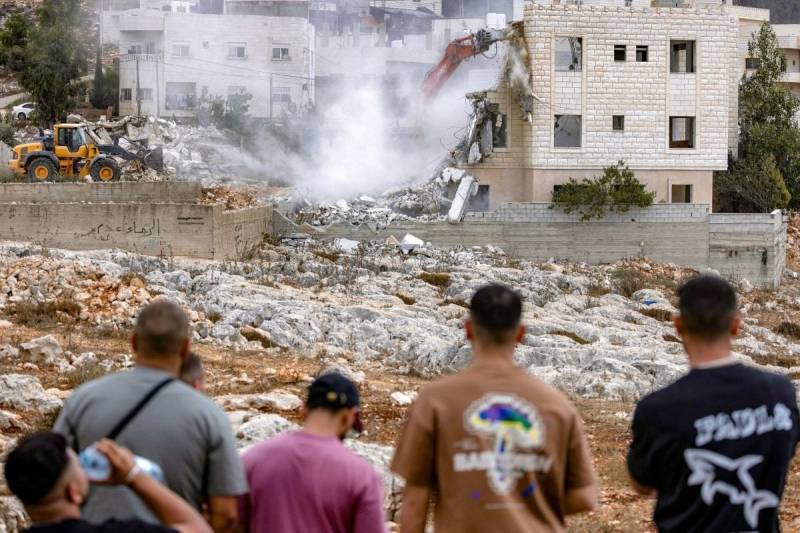 12 countries including France, UK say will sanction trade with Israeli settlements