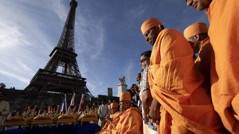 Eiffel Tower reopens after row over removing women staff
