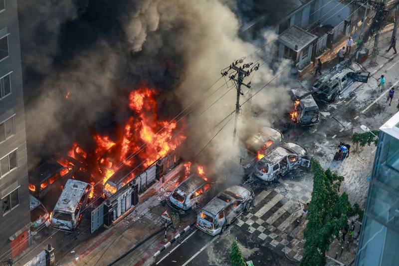 Several people injured as grenades explode and buses burn in Dhaka