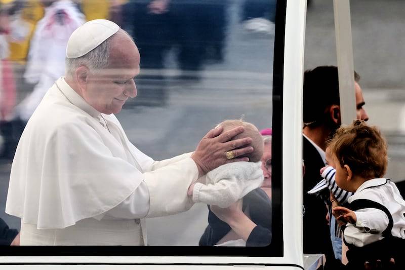 'He said hello': Families pray with pope on Paris avenue