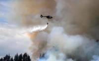 Helicopters battle wildfire threatening Ecuador's capital