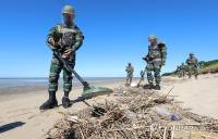 South Korea, UN force inspect DMZ area of suspected mine blast